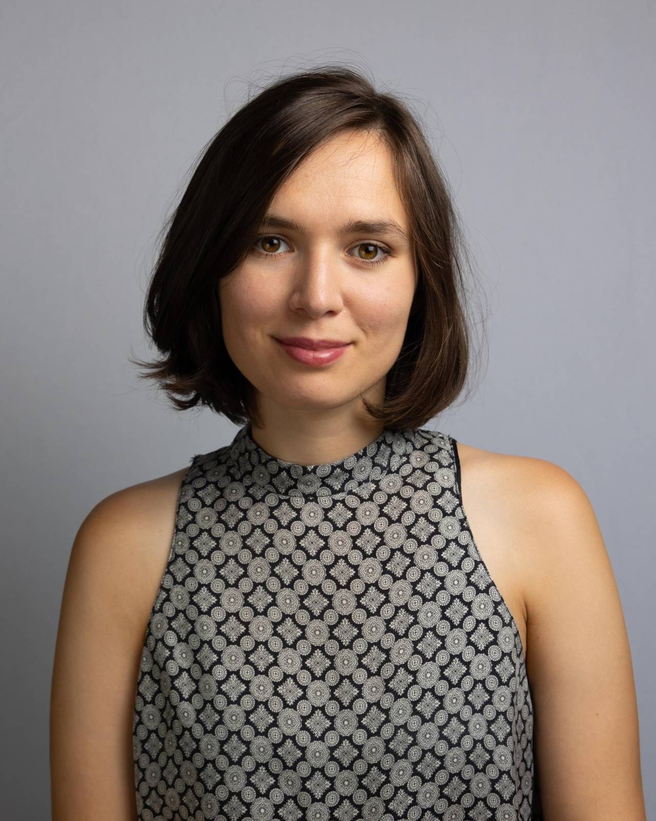 business portrait of young woman with short dark hair